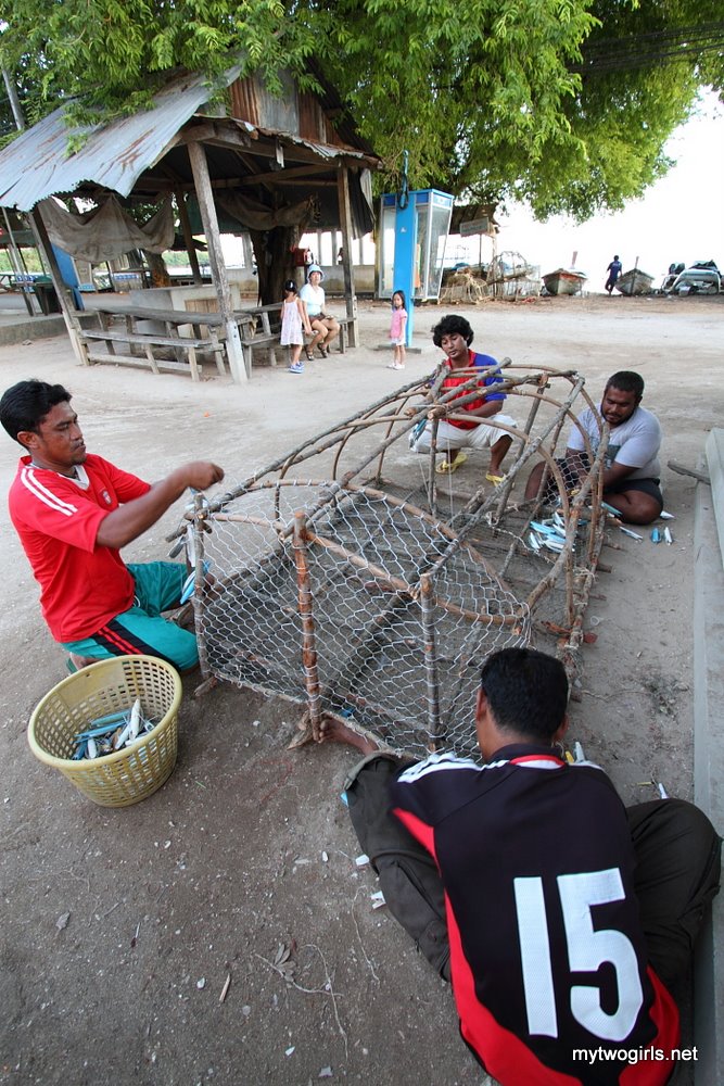 Gypsy men making fish cage